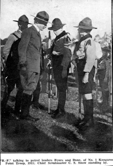 Lord Baden-Powel talking to patrol leaders Byers and Done, of No. 1 Kangaroo Point troop, 1911; Chief Scoutmaster C. S. Snow standing by